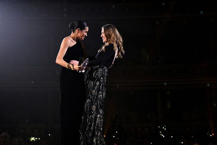 Meghan Markle presents Clare Waight Keller with Designer of the Year at British Fashion Awards