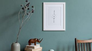 Minimalistic composition of sitting room interior with white mock up picture frame. Design home decor. Template. Eucalyptus color concept.