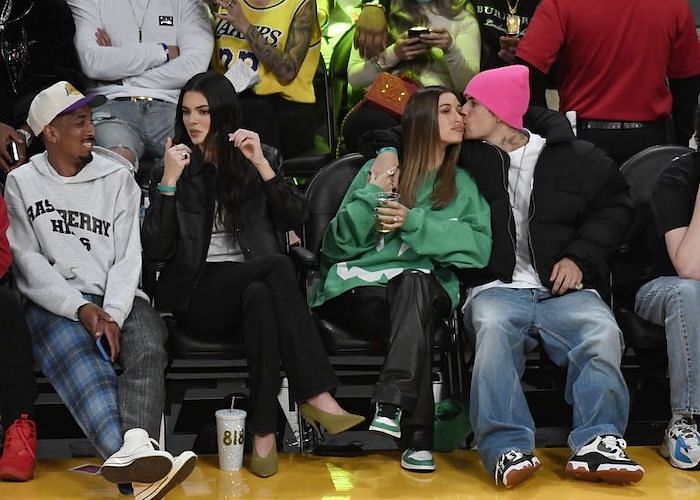 Hailey Bieber Wears a Halloween Sweater and Leather Pants to an NBA Game