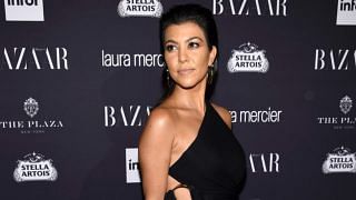 Kourtney Kardashian Paired a Cropped Leather Jacket with Waist-Cutout Trousers