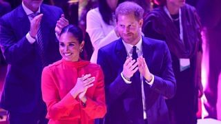 Duchess Meghan Is Vibrant in a Head-to-Toe Crimson Suit