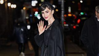 Lily Collins Channels Audrey Hepburn in a Black Cocktail Dress and Fishnet Veil