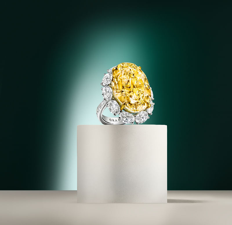 Diamond ring with a 38.88-carat fancy yellow oval diamond